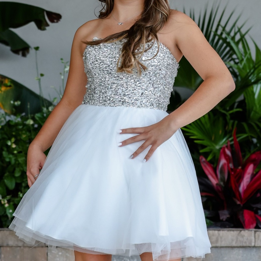 This dress is from ask Alice boutique. rhinestone on the top half. white/sliver